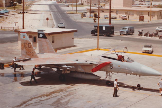 F-15A 75-022 with her tan paint job getting towed into the wash rack for cleaning. Photo by Tom Moore.
