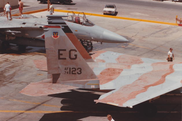 F-15A 74-123 with her mottled tan paint job getting towed into the wash rack for cleaning. Photo by Tom Moore.