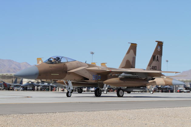 The F-15 later flew in a 'professional' tan scheme with the 65th Aggressor Squadron at Nellis, even sporting tan drop tanks. Photo by Ed Rivera.