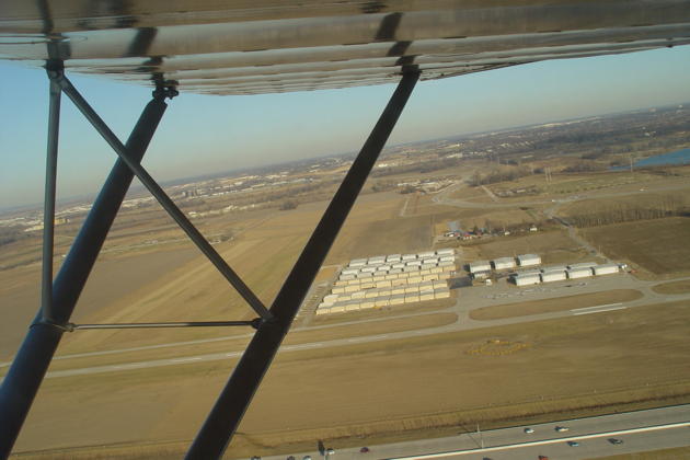 A view of the runway and multiple hangars at Creve Coeur airport, Missouri under the wing of Tim Bischof's Cessna 120.
