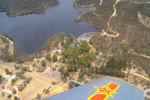 Rolling in on the Barossa Reservoir Dam in the Nanchang CJ-6 in South Australia. Nice wing insignia!