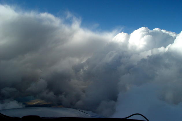 After 108 degrees on the ground, a wall of icy cumulus ahead at Flight Level 200 enroute along the California/Nevada border.