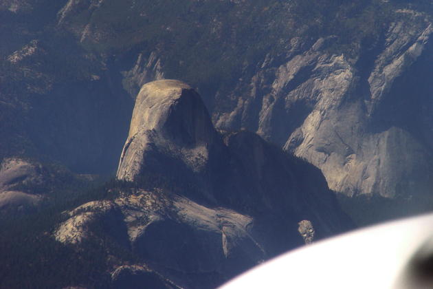 A stunning view of Half Dome from 19,000 feet over Yosemite National Park.