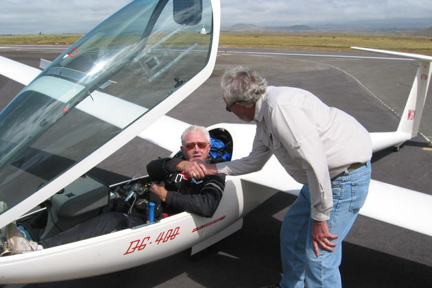 Woody Woods congratulating Dave Bigelow after Dave set the new Hawaiian soaring altitude record of 33,531 feet in the Mauna Kea wave in April 2008 in his DG-400. Photo courtesy of Dave Bigelow.