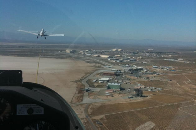 On tow in the first USAF Academy DG-1001 over the Edwards AFB dry lake bed.