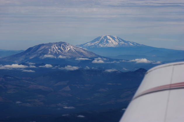A couple of our local 'hills', Mt. St. Helens and Mt. Adams, welcome us on the descent home.
