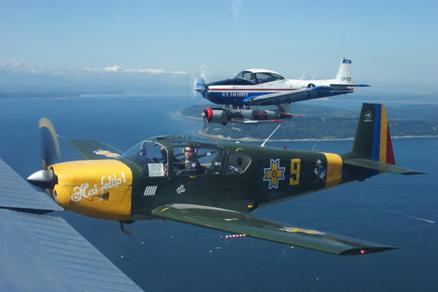 Bob Hill's IAR-823, Ray Roussy's Navion and Ron Morrell's CJ-6 formate in echelon.
