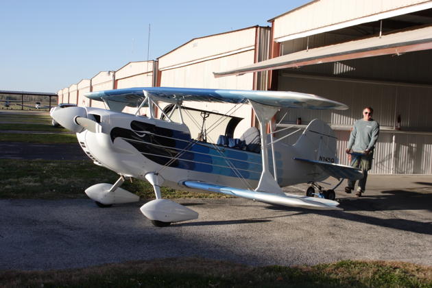 Bill Sommer maneuvering his Christen Eagle II out of his hangar at Creve Coeur airport.