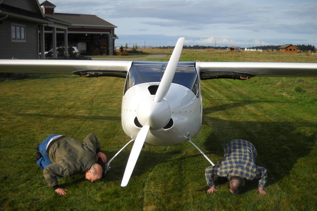 Kissing the ground (in jest) after a successful first flight! Photo by Dan Masys.