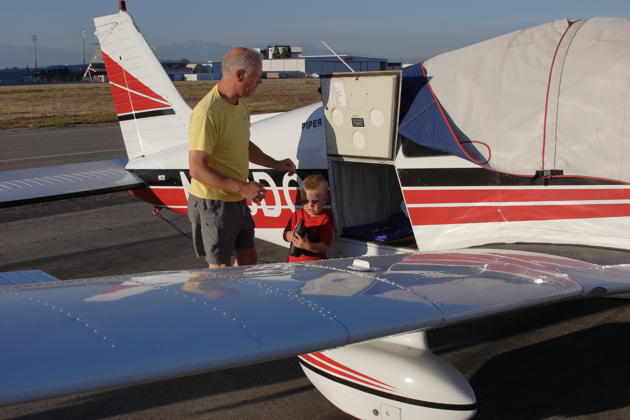 Alex helping to top off our oil at the Long Beach airport. Photo by David Kasprzyk.