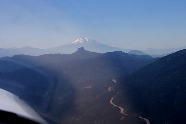 Following I-5 as it winds through the Siskiyou Mountains, with Pilot Rock and Mt Shasta in the distance.
