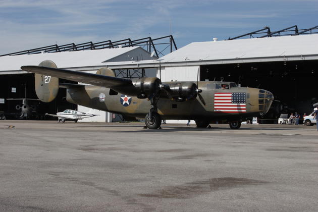 B-24 Diamond Lil parked in front the combined B-29/B-24 hangar.