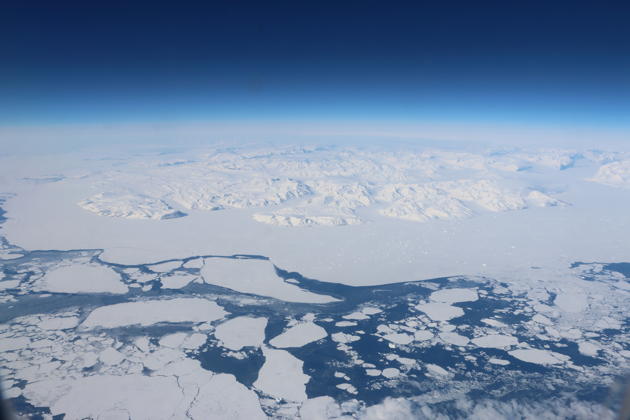 A view of the west coast of Greenland returning from Israel in early May, with giant ice floes breaking apart from the coastal ice.