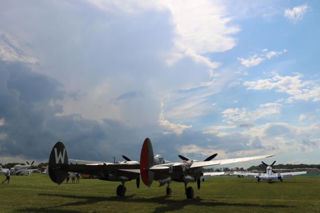 A beautiful P-38 and Mustangs under threatening skies that never reached Oshkosh all week.
