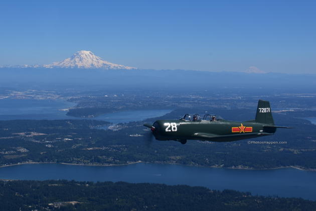 Joining in formation in Justin Draft's Nanchang CJ-6, with Tom Gordon in my backseat, with Mt. Rainier and Mt Adams in the distance. Photo by Karyn 'SkyQueen' King.