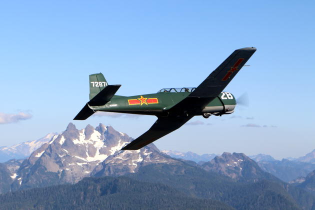 Justin's Nanchang CJ-6 and Three Fingers Mountain. Photo by Doug Happe.