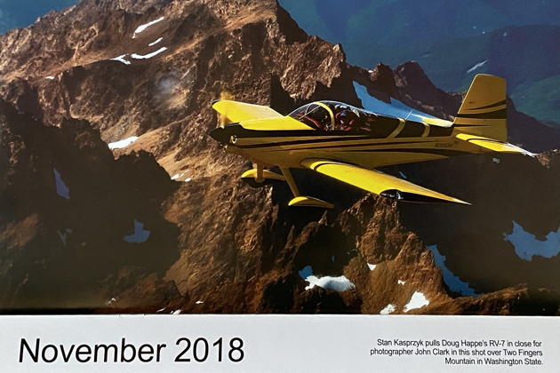 The November 2018 Van's Aircraft calendar shot! The caption writer listed 'Two Fingers Mountain', instead of the actual 'Twin Sisters' background, but still nicely done! Photo by John Clark.
