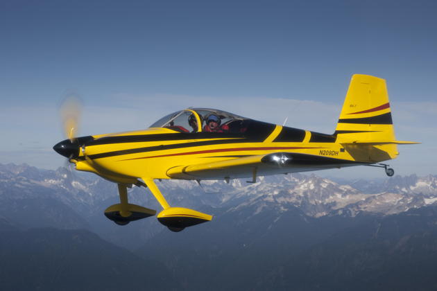 A sleek side view of the RV-7 over the Cascades. Photo by John Clark.
