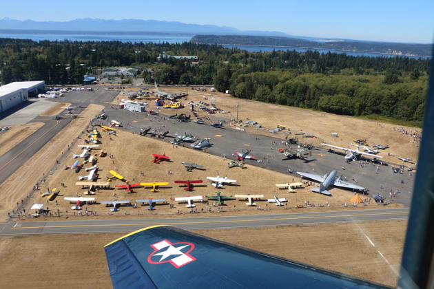 A great view of the aircraft staged at Paine Field for Vintage Aircraft Weekend 2017, from the perspective of Smokey Johnson's T-6 as we pitch out for landing.