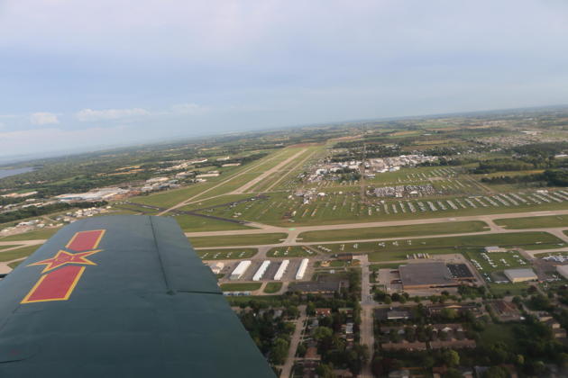 A great view from the Nanchang of the north Oshkosh ramp after pitching out on runway 27 after the Warbird arrival.