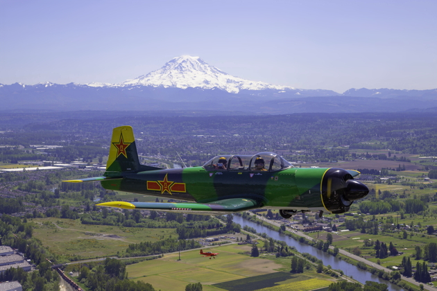Larry Pine's Nanchang CJ-6 and the RV-8 photo chase with Mt. Rainier. Photo by Dan Shoemaker.