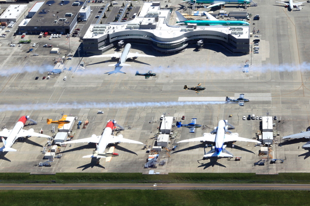All six warbirds of Bravo Flight crossing over Paine Field and Boeing heavies. Photo by Dave Richardson.