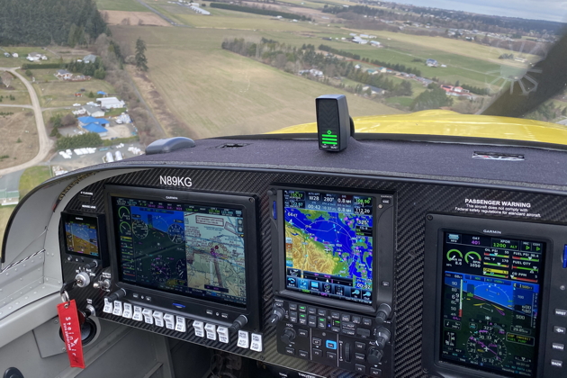 A nice view of the RV-14's all-Garmin panel, while turning final for runway 27 at Sequim Valley (W28).
