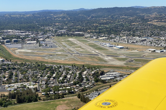 Entering right downwind for runway 32R at Concord, CA (KCCR).