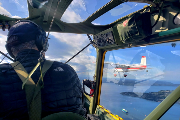 Leading with Tom Jensen's Cessna 180, view from Bob Stoney's O-1 Bird Dog. Photo by Dave Desmon.