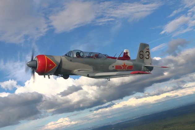 Chris 'Lights Out' Walker in his Nanchang CJ-6, hiding Brian Youmans' Nanchang, on an early evening flight out of Bremerton.