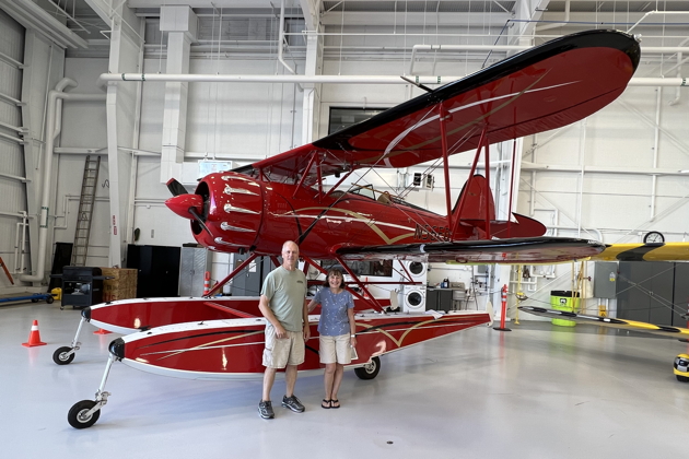 Checking out a WACO YMF-5 on amphib floats that I had previously flown in Kauai, now at the WACO factory in Battle Creek, Michigan on Day 6.