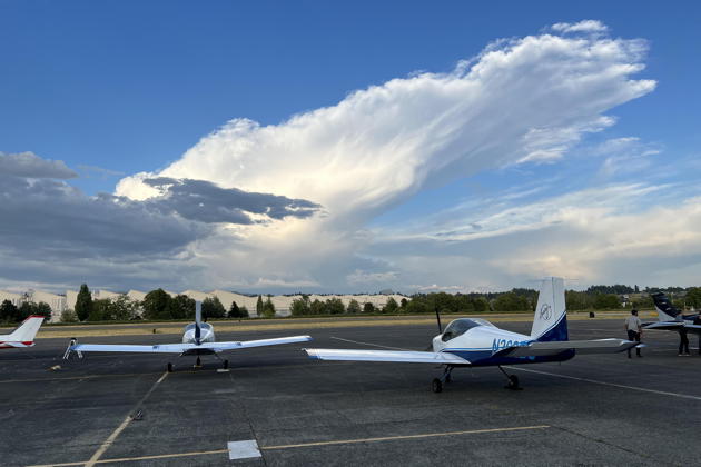 Two new BEFA RV-12s at Renton getting ready for formation, with an impressive anvil cloud over the Cascades.
