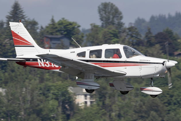 Landing at Renton in my Warrior, N313DC, in a photo discovered after my flight review with Stan Mars. Photo by Spotter Powwwiii.