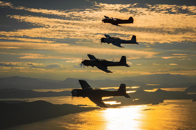 Great photo of Canadian Nanchangs (and Yak-18) back in Canadian airspace near sunset. Photo by Geert Van de Put.