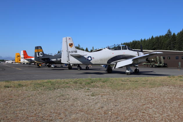 The impressive T-28 lineup at Bremerton: Charlie Guthrie's T-28B, Scott Urban's T-28B, and Roger Collins T-28C 'Lima Charlie' and T-28D 'Lumpy'. My photo.