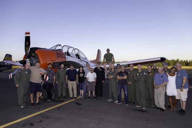 Attendees at the 2023 NW Formation Flying clinic at Bremerton, in front of Scott Urban's T-28B. Photo by Dan 'FAGIB' Shoemaker.