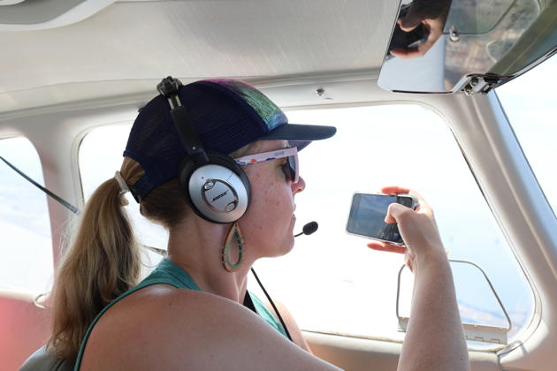 Theresa piloting and taking photos above San Francisco Bay in 3DC. My photo.