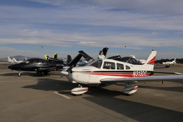 Three Cirrus Vision jets and our Warrior on the ramp at Santa Rosa. My photo.