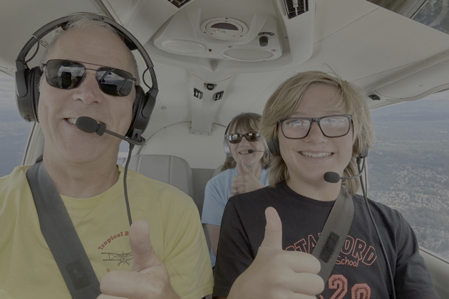 Alex's last 'summer flying school' flight, his first without Mom or Dad in the airplane! My photo.