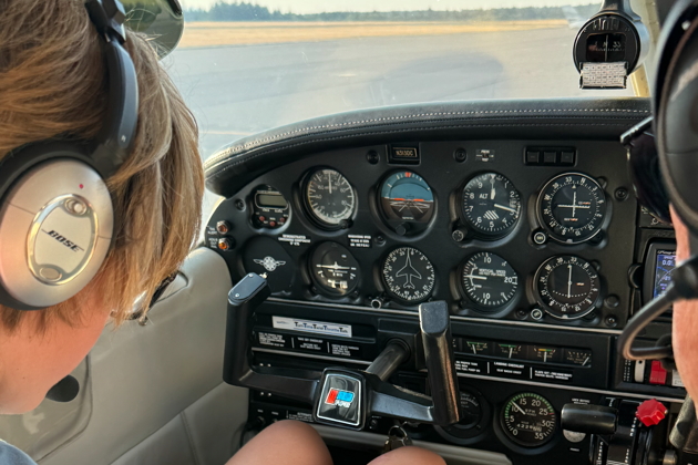 Alex using his checklist before takeoff at Tacoma Narrows. Photo by David Kasprzyk.