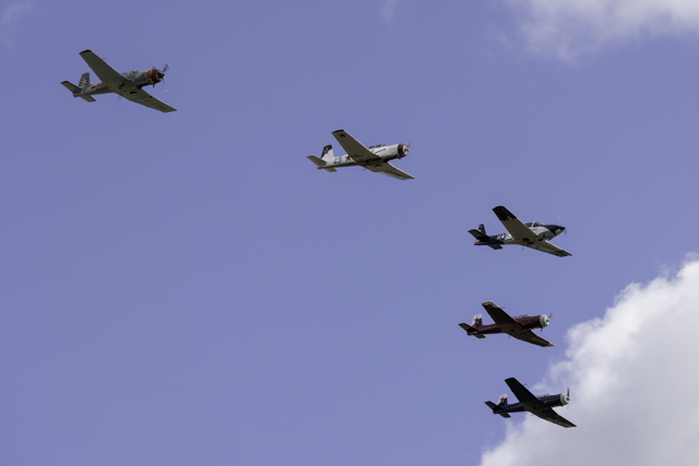 Four Canadian Nanchangs on their depature flypast, led by Roger Collins in his Navion. Photo by Dan Shoemaker.