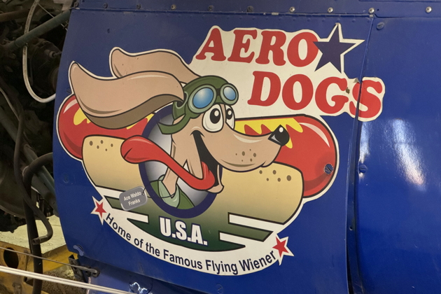 Aero Dogs 'Ace Waldo Franks' on the side of Mike Schoenau's Stearman at Johnston Aircraft Service in Tulare, CA. My photo.