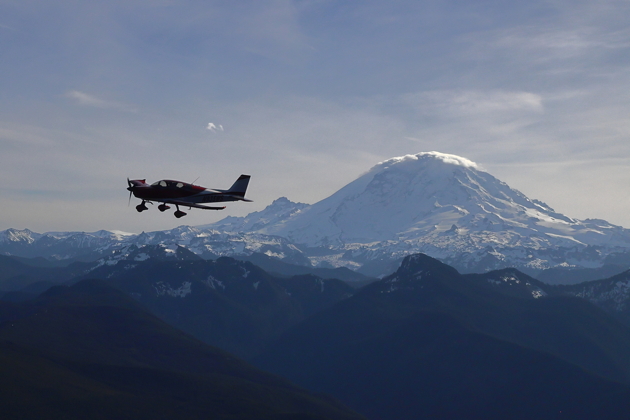 A backlit view of Brian Malcolm's Sling TSi in front of Mt. Rainier. Photo by Steve Cameron.
